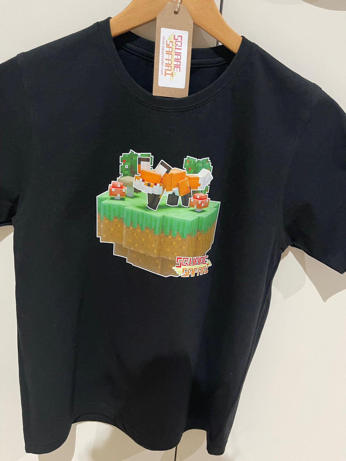 Hand-crafted pixel art red fox design on a kids t-shirt — original square-style wildlife art for gamers, animal lovers and collectors. Square Safari