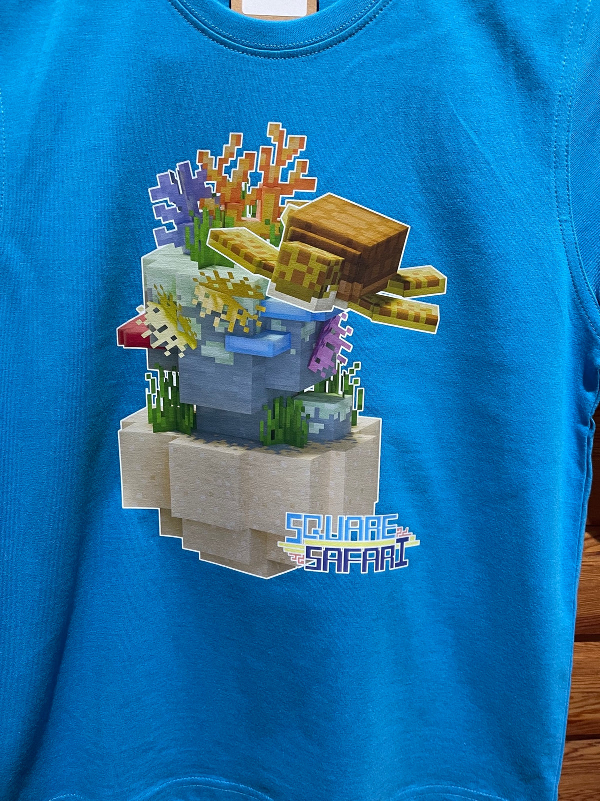 Sea Turtle Gliding Through the Ocean On Sale — Square Safari Kids T-Shirt