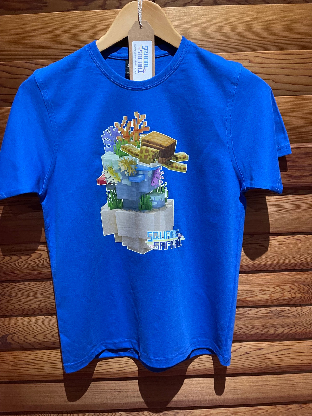Sea Turtle Gliding Through the Ocean On Sale — Square Safari Kids T-Shirt
