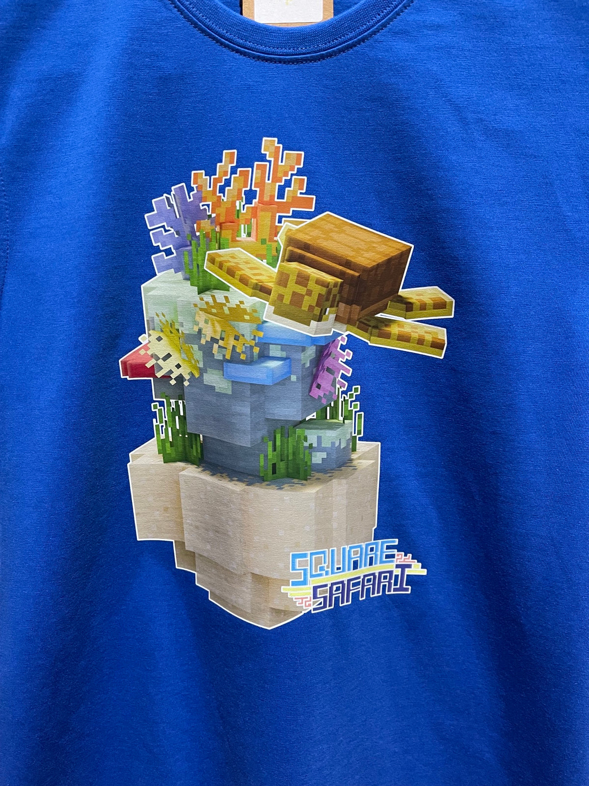 Sea Turtle Gliding Through the Ocean On Sale — Square Safari Kids T-Shirt