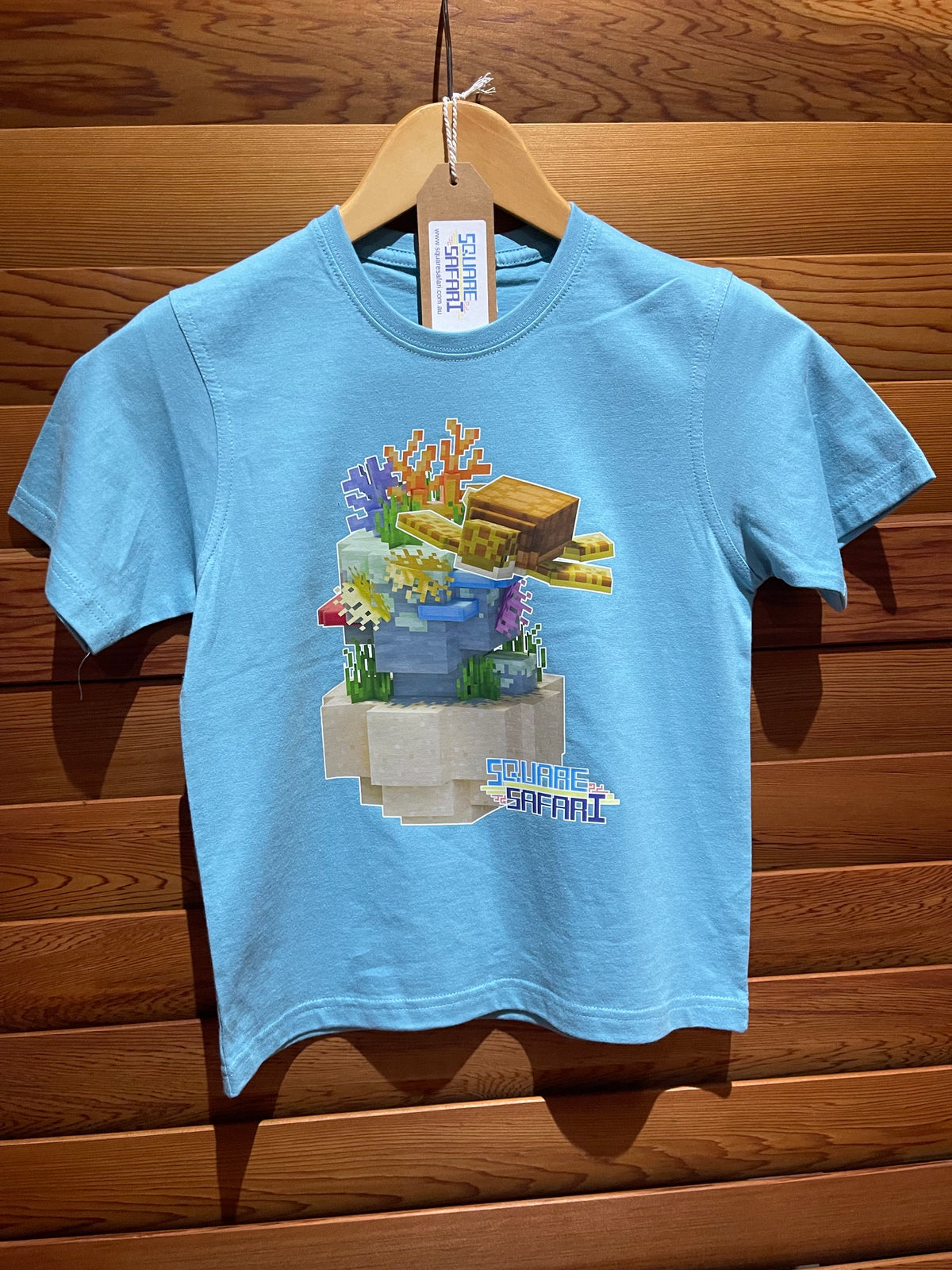 Sea Turtle Gliding Through the Ocean On Sale — Square Safari Kids T-Shirt