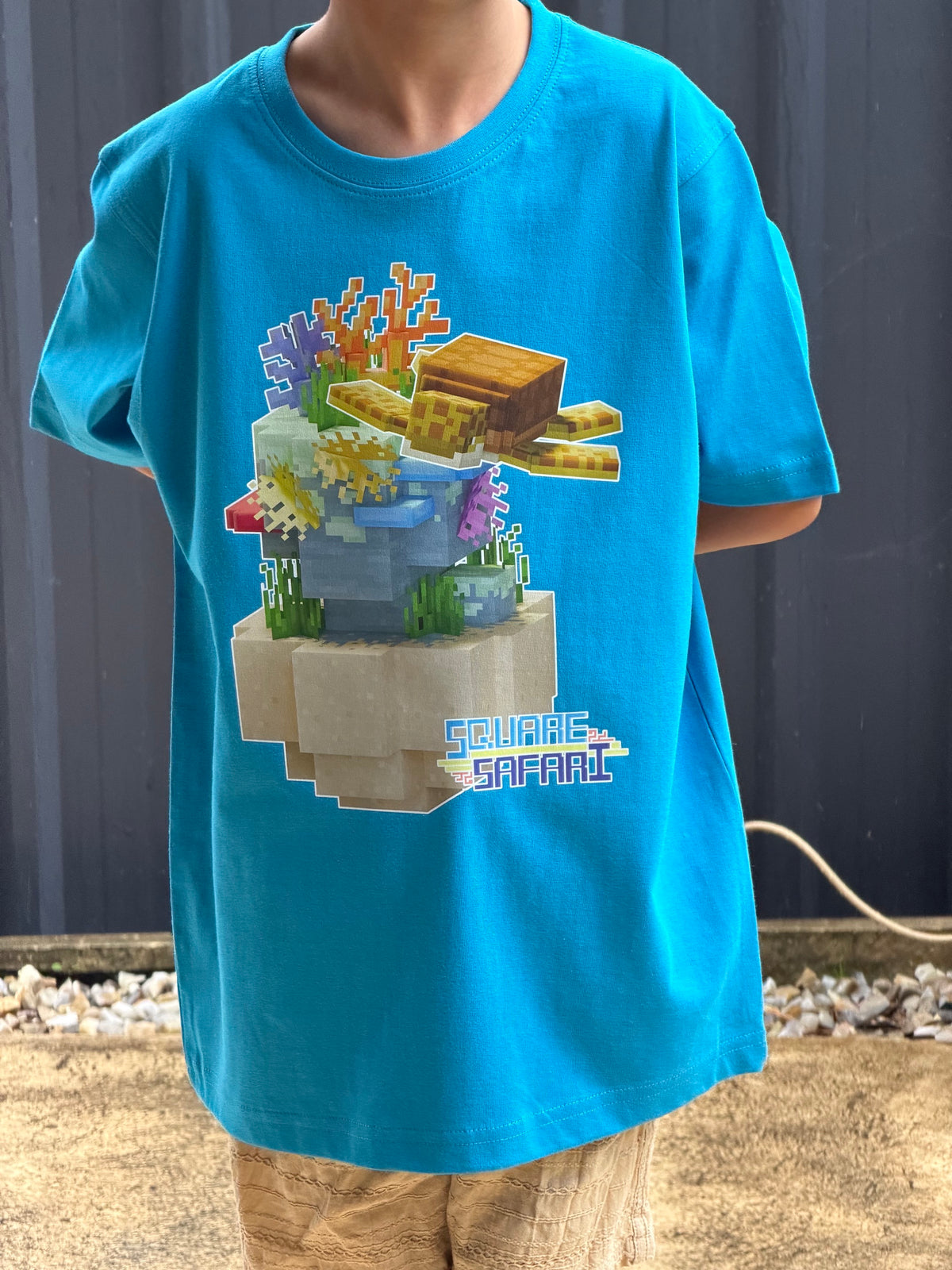Sea Turtle Gliding Through the Ocean On Sale — Square Safari Kids T-Shirt
