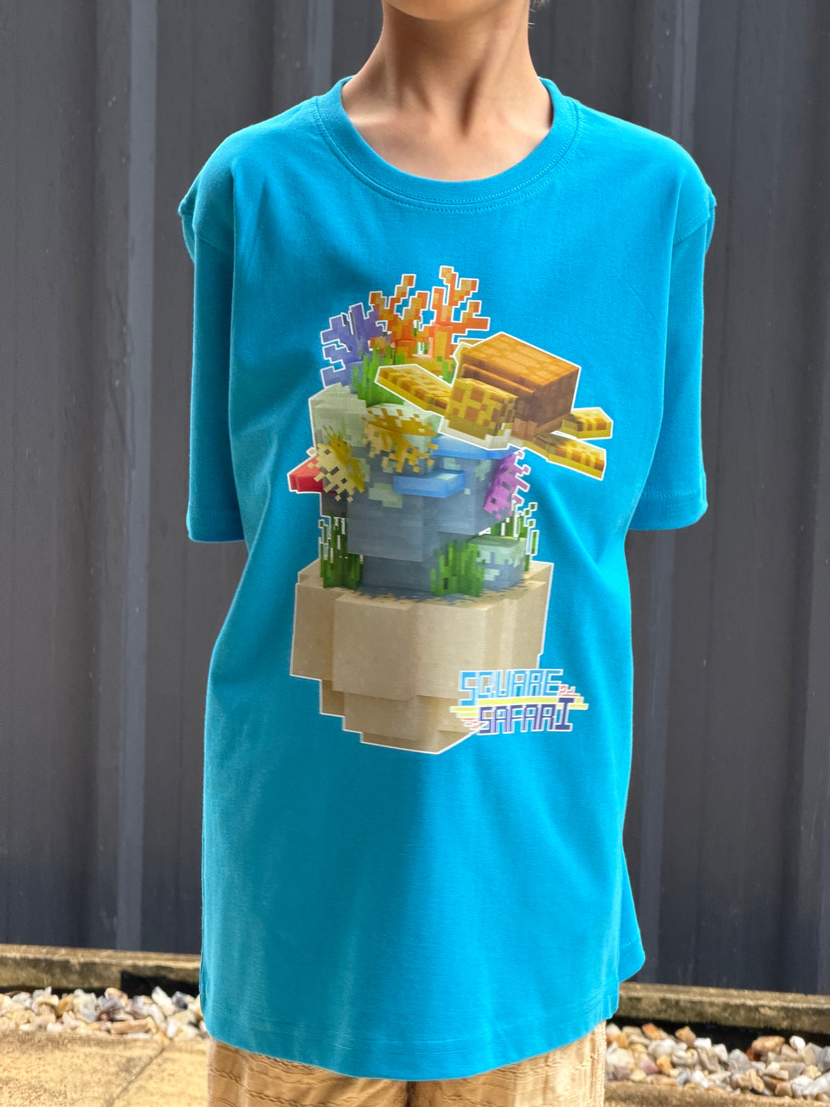 Sea Turtle Gliding Through the Ocean On Sale — Square Safari Kids T-Shirt